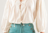 Blusa con mangas voluminosas